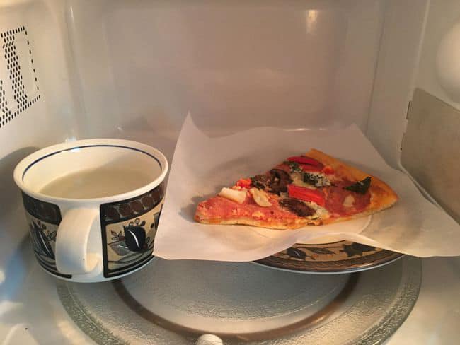 A pizza in a microwave oven