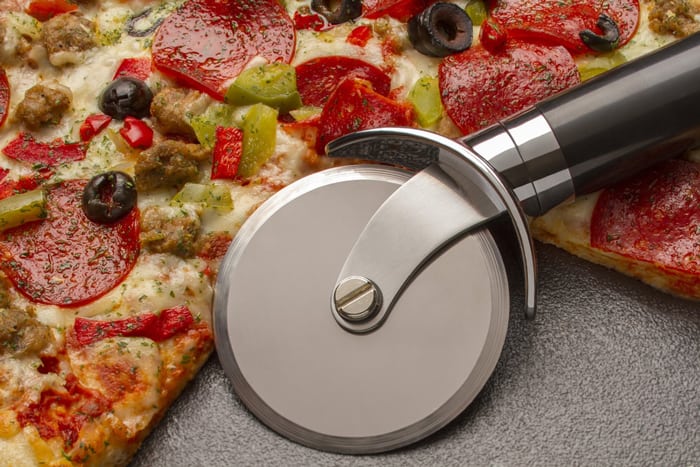 Cut a pizza into 6 slices Using a circular metal cutter
