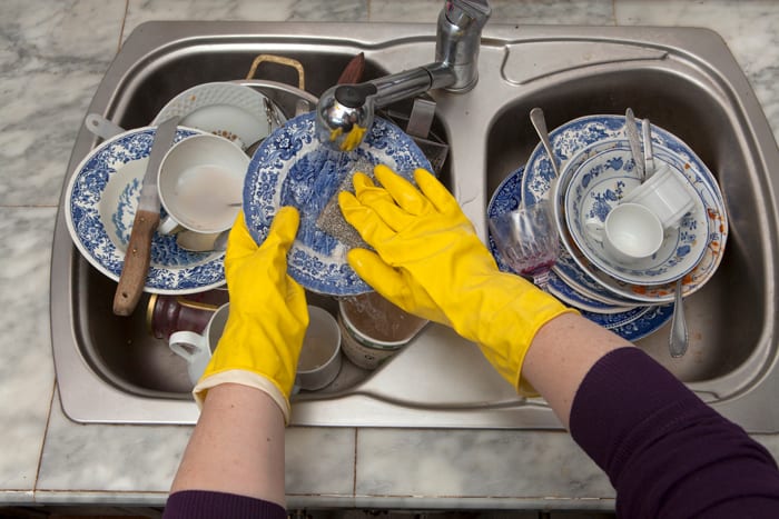 wash dishes in a farmhouse sink