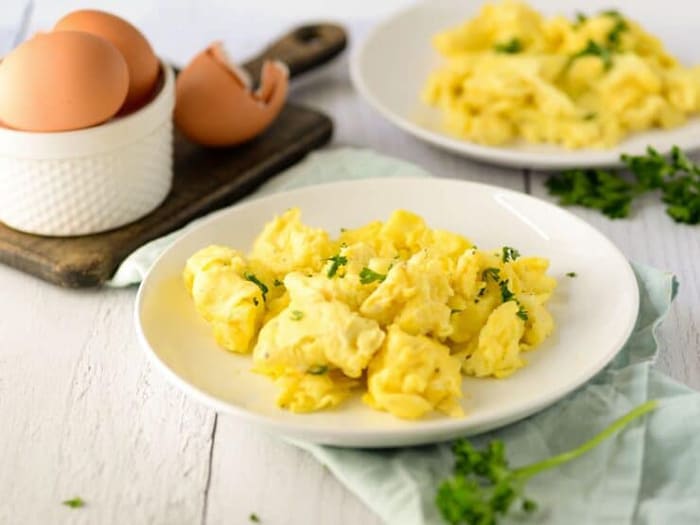 make fluffy scrambled eggs on a griddle