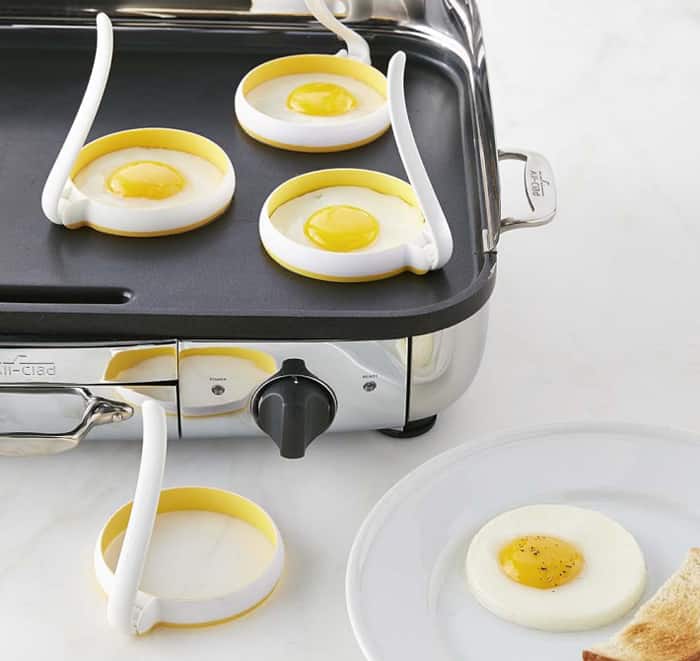 tools for frying eggs on a griddle